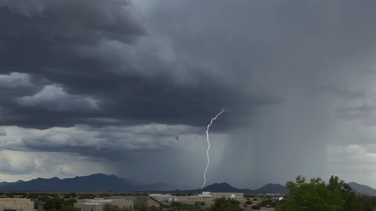 Lightning bolt against the high desert sky in summer thunderstorm